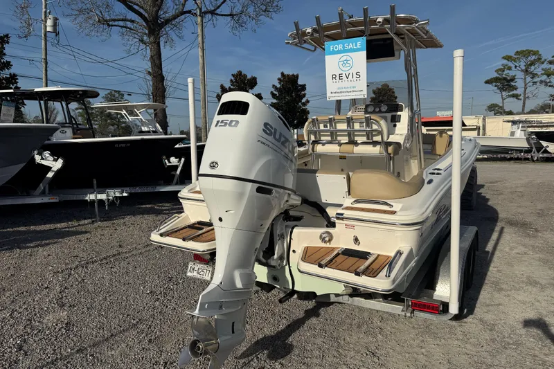 Slide: The Image of 2021 Pioneer 202 Islander boat for sale with Suzuki 150 engine, displayed outdoors. - 9