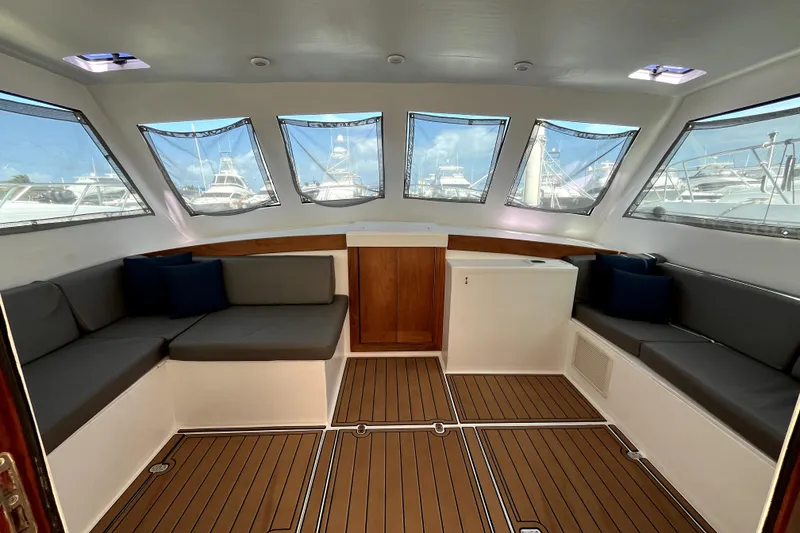 Slide: The Image of Interior of 1982 Torres Boat Mfg 43, featuring spacious seating and large windows. - 12