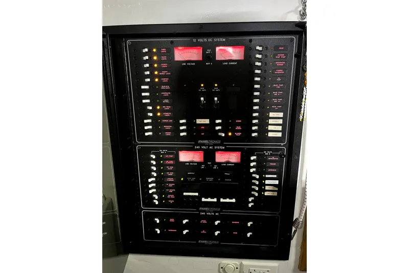 Slide: The Image of Electrical control panel on a 1982 Torres Boat Mfg 43, featuring various switches and indicators. - 13