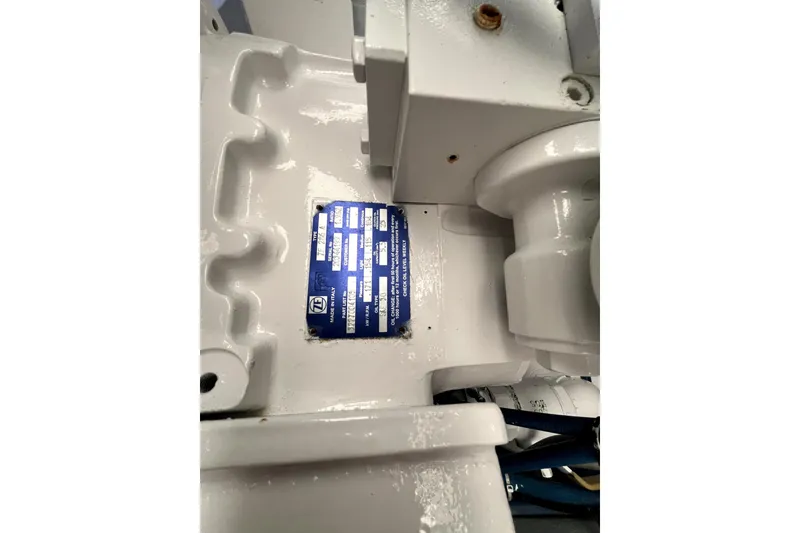 Slide: The Image of Engine compartment of a 1982 Torres Boat Mfg 43, featuring a blue identification plate. - 23