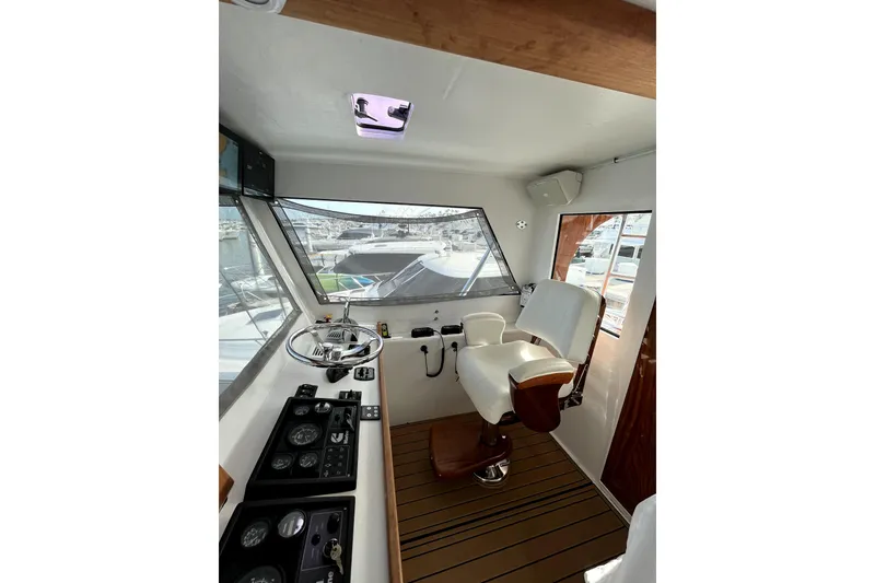 Slide: The Image of Interior view of 1982 Torres Boat Mfg 43, featuring helm and captain's chair. - 36