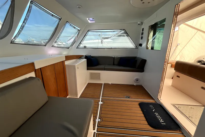 Slide: The Image of Interior of 1982 Torres Boat Mfg 43, featuring bunk beds and wooden flooring. - 11