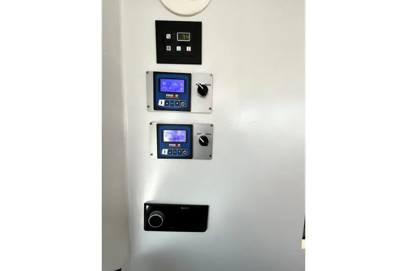 Slide: The Image of Control panel on a 1982 Torres Boat Mfg 43, featuring digital displays and knobs. - 17