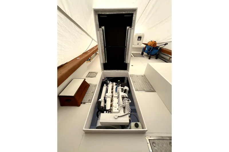 Slide: The Image of Engine compartment of a 1982 Torres Boat Mfg 43, showcasing a clean, organized layout. - 19