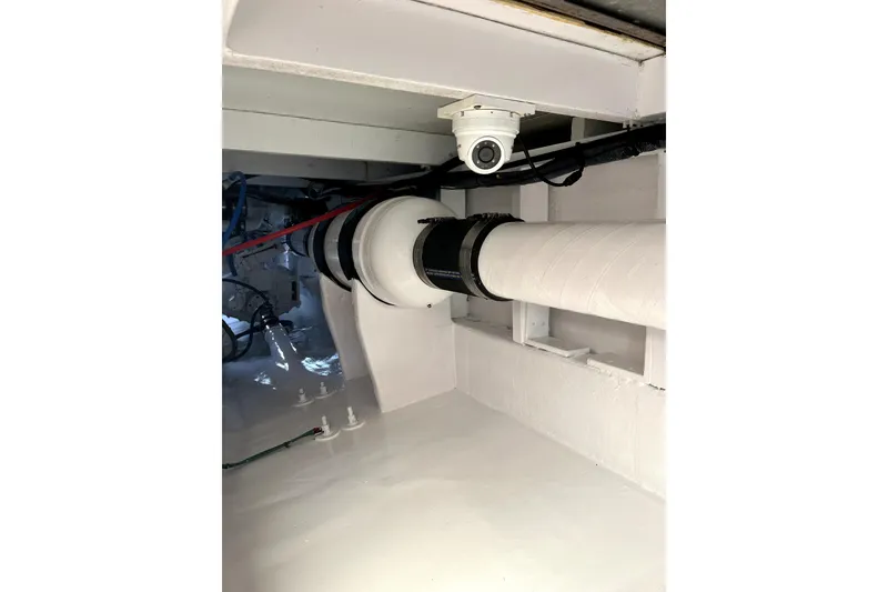 Slide: The Image of Interior view of a 1982 Torres Boat Mfg 43, showcasing mechanical components and piping. - 30