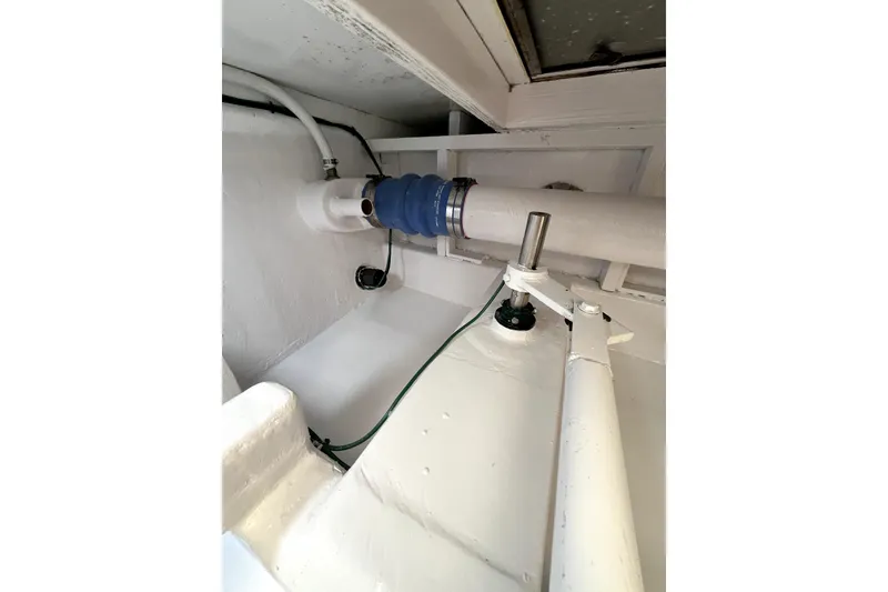 Slide: The Image of Interior view of a 1982 Torres Boat Mfg 43, showcasing mechanical components and wiring. - 31