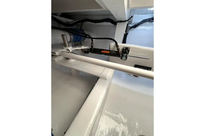 Slide: The Image of Bilge area of a 1982 Torres Boat Mfg 43, featuring wiring and plumbing components. - 32