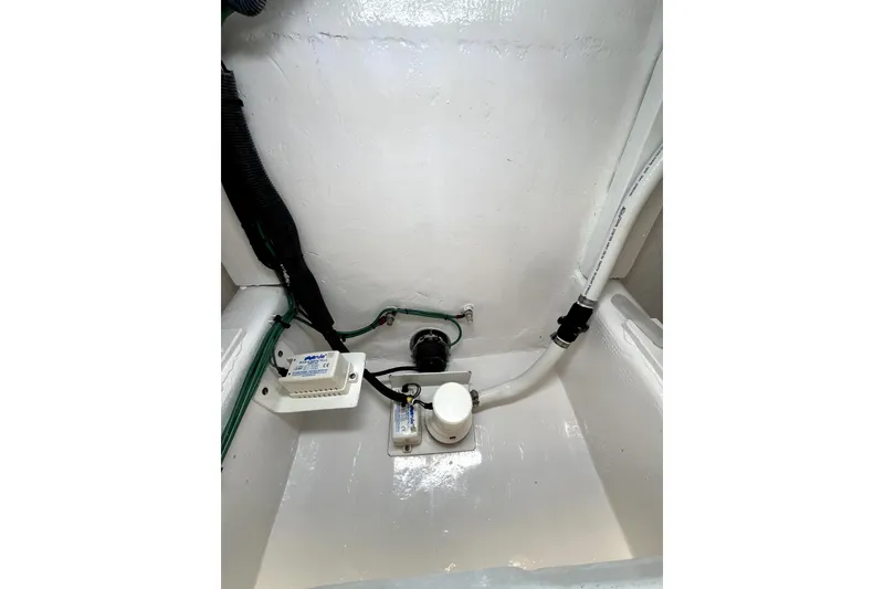 Slide: The Image of Interior of a 1982 Custom 43 boat with rods and equipment. - 33