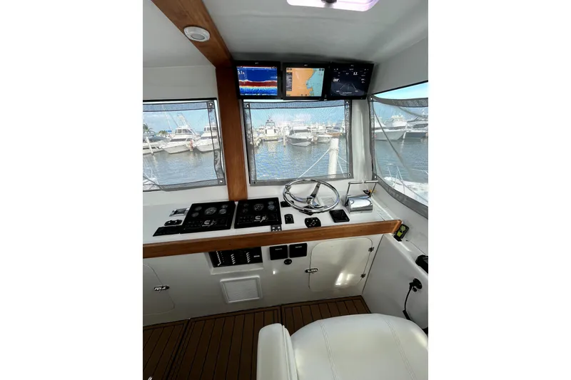 Slide: The Image of Interior view of 1982 Torres Boat Mfg 43, featuring helm and captain's chair. - 35