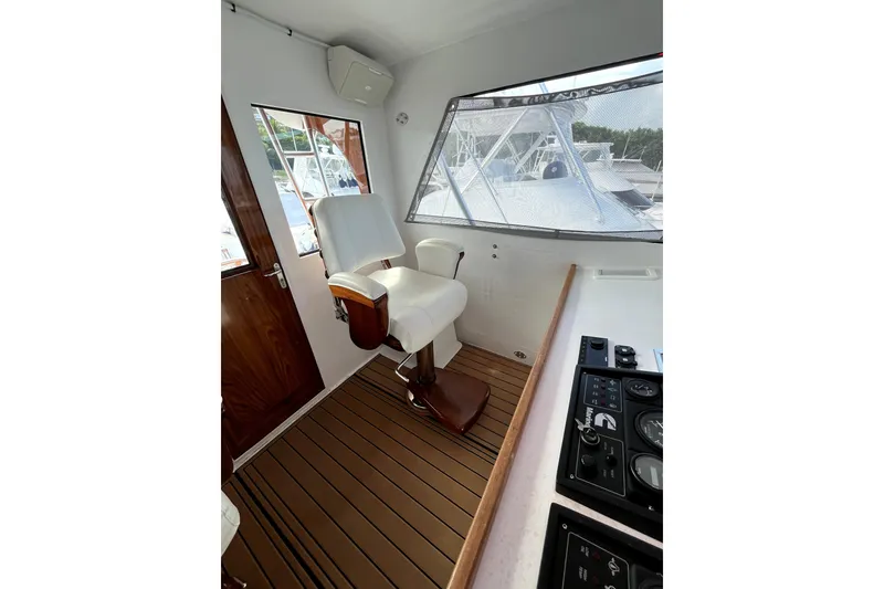 Slide: The Image of Bow view of 1982 Torres Boat Mfg 43, docked in a marina. - 39