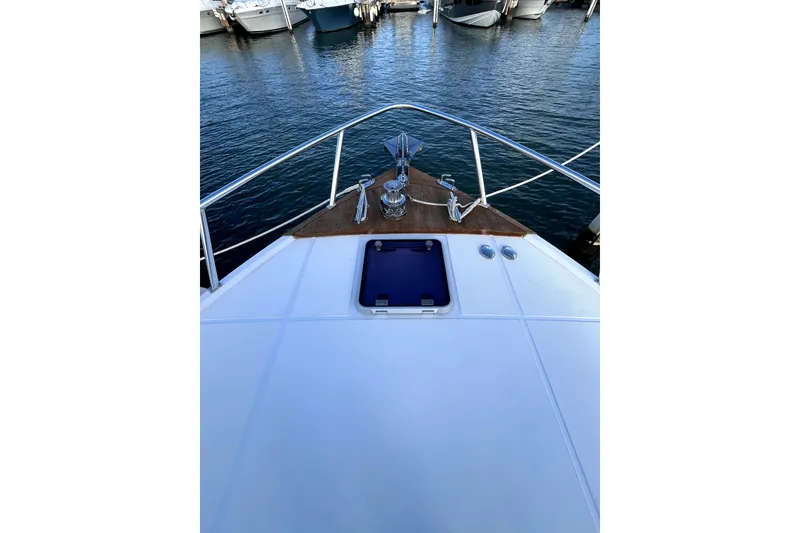 Slide: The Image of Interior view of a 1982 Torres Boat Mfg 43, featuring wooden finishes and a ladder. - 41