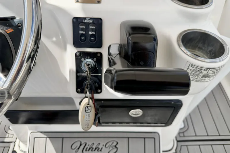 Slide: The Image of Control panel of 2014 Tidewater 230 LXF boat with steering wheel and ignition keys. - 20
