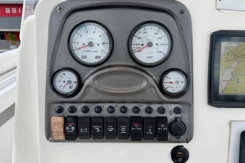 Slide: The Image of Dashboard of a 2014 Tidewater 230 LXF boat with Yamaha gauges and controls. - 21