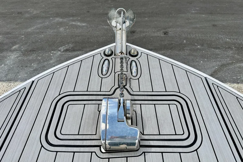 Slide: The Image of Bow of 2014 Tidewater 230 LXF boat with anchor and sleek deck design. - 31