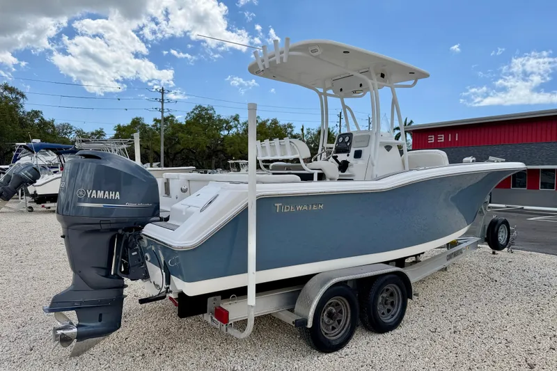 Slide: The Image of 2014 Tidewater 230 LXF boat with Yamaha engine on trailer, parked outdoors. - 5