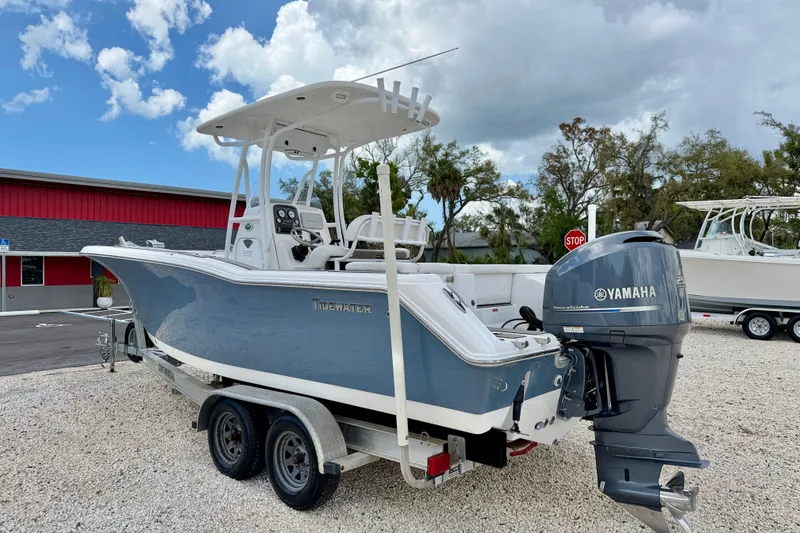 Slide: The Image of 2014 Tidewater 230 LXF boat with Yamaha engine on trailer, parked outdoors. - 7