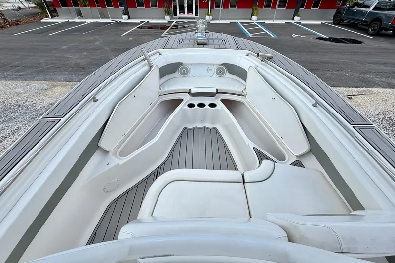 Slide: The Image of 2014 Tidewater 230 LXF boat interior with seating and storage compartments. - 9