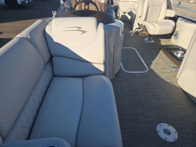 Slide: The Image of Interior of a 2015 Bennington 2250 GSR pontoon boat with beige upholstery. - 10