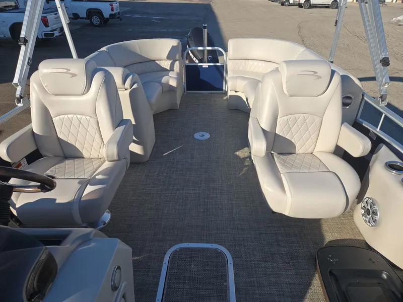 Slide: The Image of Interior of a 2015 Bennington 2250 GSR pontoon boat with luxurious seating. - 12