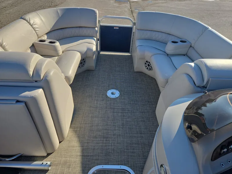 Slide: The Image of Interior of a 2015 Bennington 2250 GSR pontoon boat with beige seating. - 19