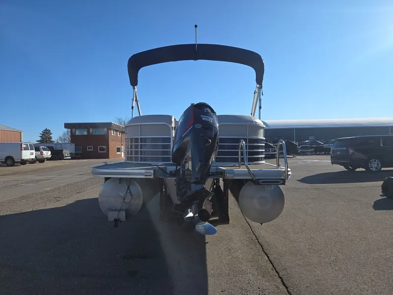 Slide: The Image of 2015 Bennington 2250 GSR pontoon boat in parking lot. - 7