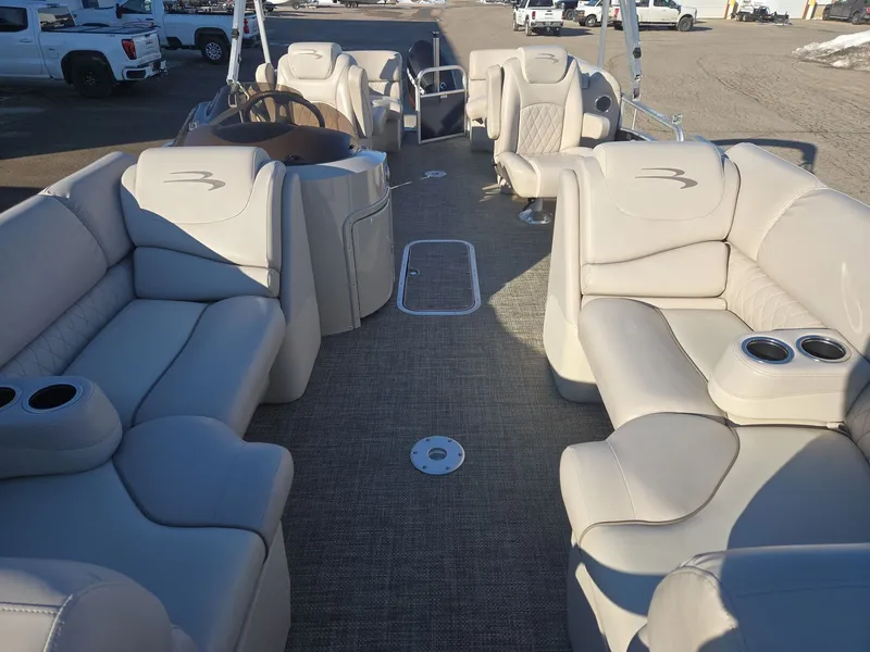 Slide: The Image of Interior of a 2015 Bennington 2250 GSR pontoon boat with beige seating. - 9