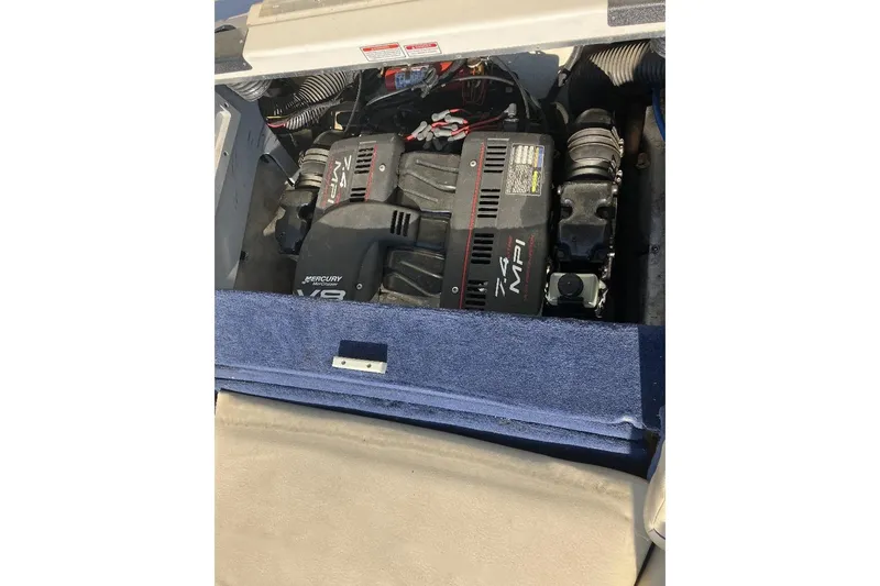 Slide: The Image of Engine compartment of a 2000 Sea Ray 230 Signature boat with Mercury V8 engine. - 10