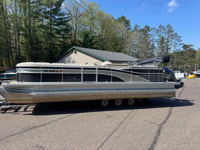 The Image of 2013 Bennington 2550RCB ESP TRI pontoon boat on trailer. - 1