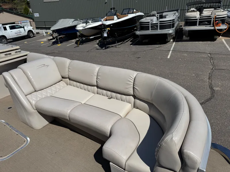 Slide: The Image of 2013 Bennington 2550RCB ESP TRI with beige leather outdoor seating. - 10