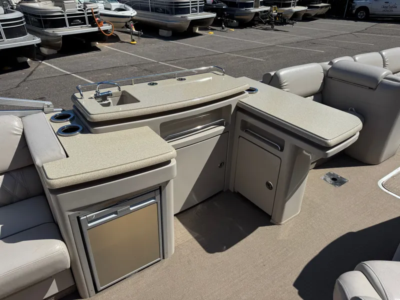 Slide: The Image of Interior of a 2013 Bennington 2550RCB ESP TRI with kitchenette. - 16