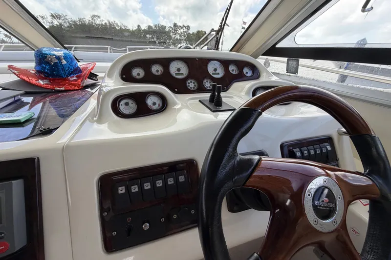 Slide: The Image of Dashboard of 2007 Cranchi Atlantique 40 yacht with steering wheel and control gauges. - 16