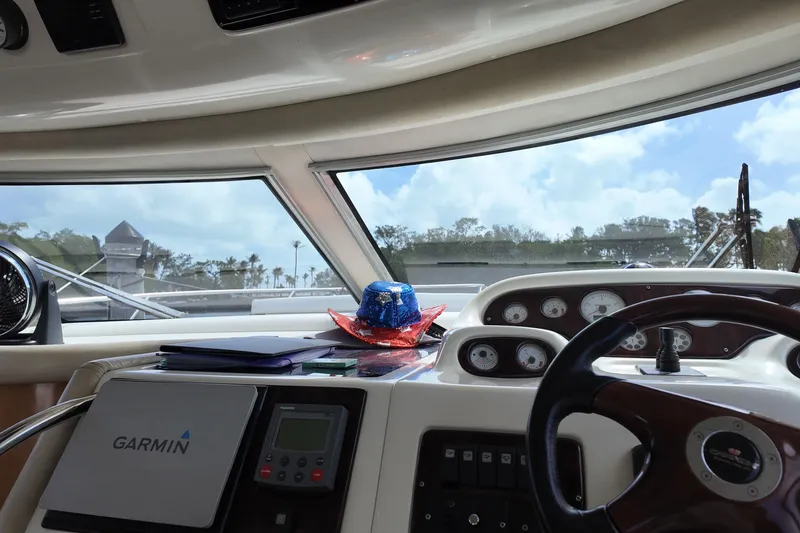 Slide: The Image of Interior view of 2007 Cranchi Atlantique 40 yacht cockpit with Garmin navigation system. - 17