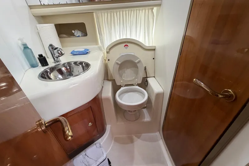Slide: The Image of Luxurious 2007 Cranchi Atlantique 40 yacht bathroom with sink and toilet. - 23