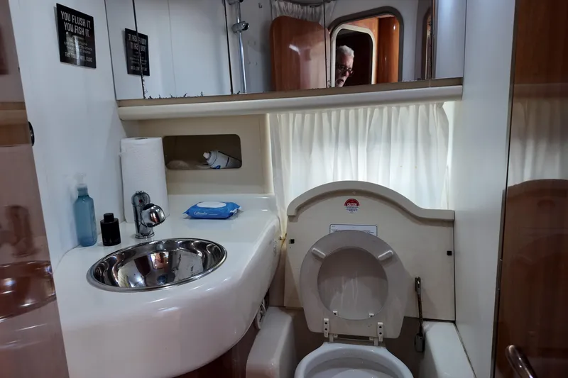 Slide: The Image of Bathroom interior of 2007 Cranchi Atlantique 40 yacht with sink and toilet. - 24