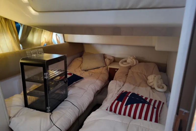 Slide: The Image of Cozy cabin interior of 2007 Cranchi Atlantique 40 yacht with twin beds and nautical decor. - 25