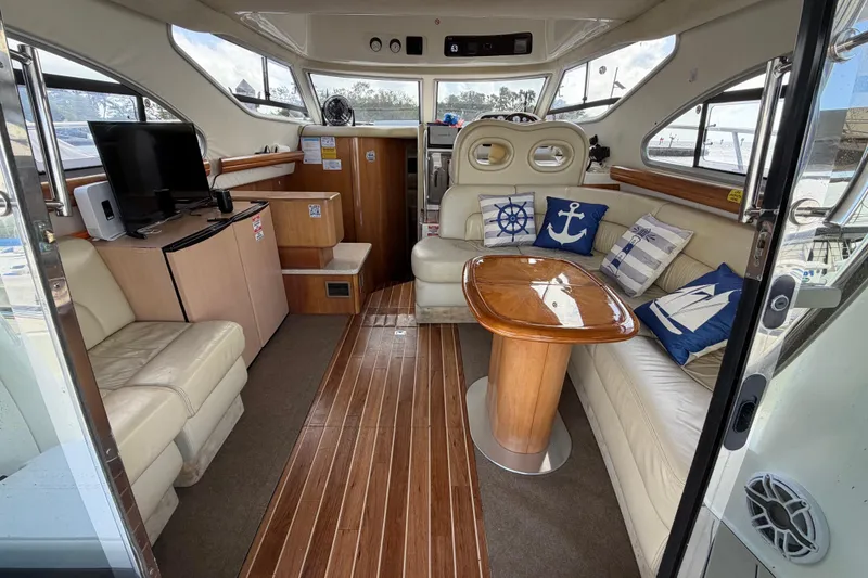 Slide: The Image of Luxurious 2007 Cranchi Atlantique 40 yacht interior with elegant seating and nautical decor. - 9