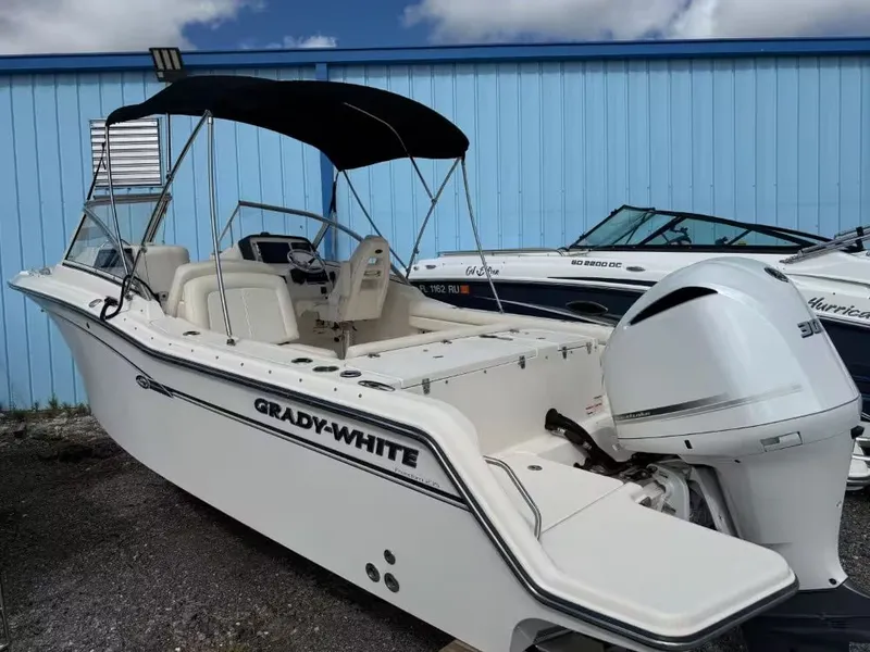 Slide: The Image of 2019 Grady-White Freedom 235 boat with outboard motor. - 3