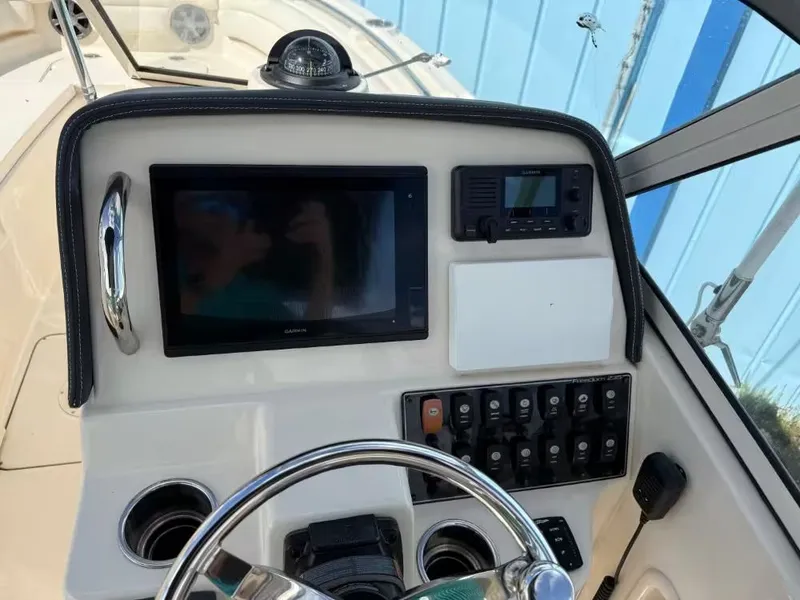 Slide: The Image of Dashboard of 2019 Grady-White Freedom 235 boat. - 9