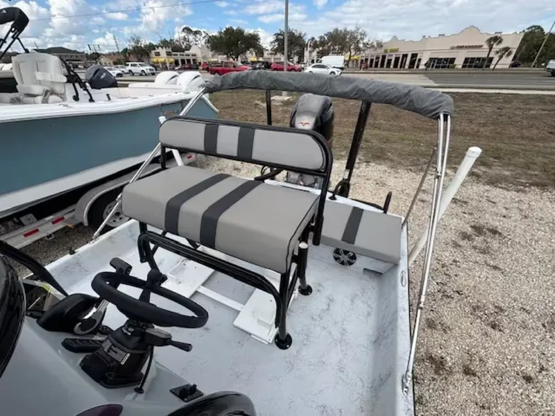 Slide: The Image of 2022 Shoalwater 20 CAT boat with gray seating and steering wheel. - 7