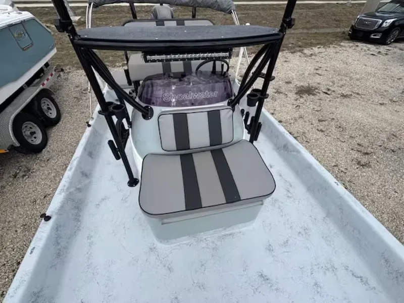Slide: The Image of 2022 Shoalwater 20 CAT boat with gray seats and black frame. - 9