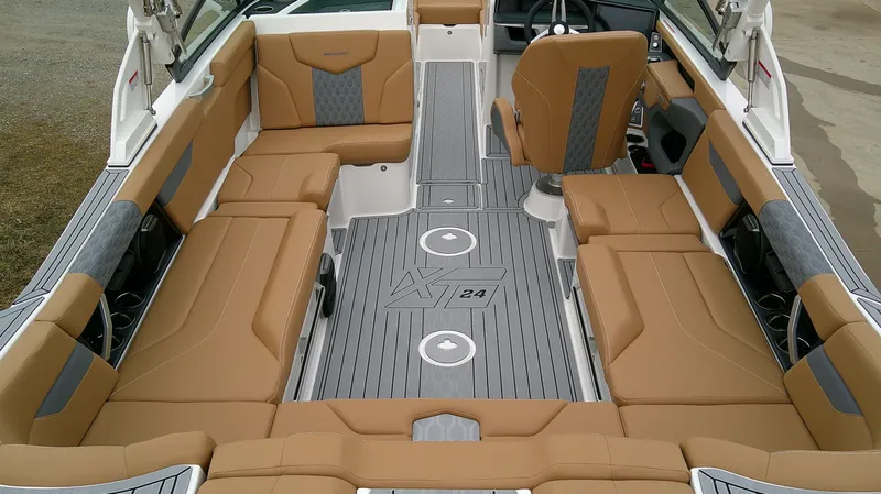 Slide: The Image of Interior of 2026 MasterCraft 24 XT with brown seating. - 10