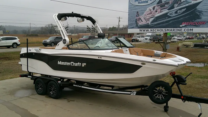 Slide: The Image of 2026 MasterCraft 24 XT boat on trailer at Nichols Marine. - 3