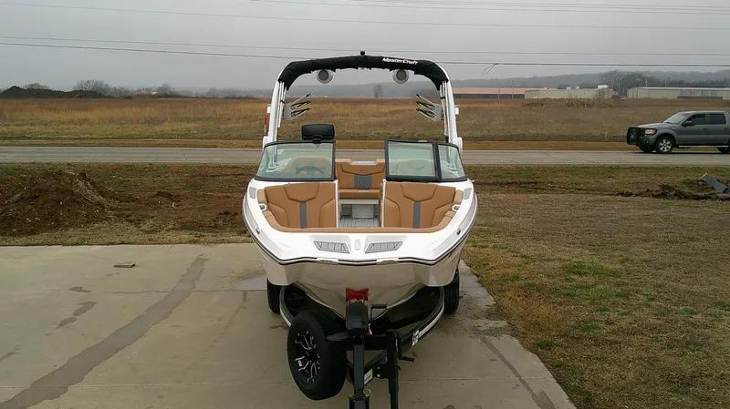 Slide: The Image of 2026 MasterCraft 24 XT boat on trailer, ready for adventure. - 4