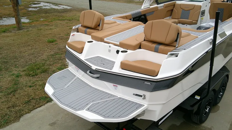 Slide: The Image of Rear view of 2026 MasterCraft 24 XT with luxurious seating. - 7