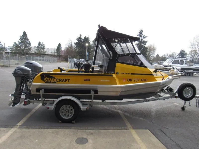 Slide: The Image of 2021 Stabicraft 1550 Fisher boat on trailer, yellow and black. - 6