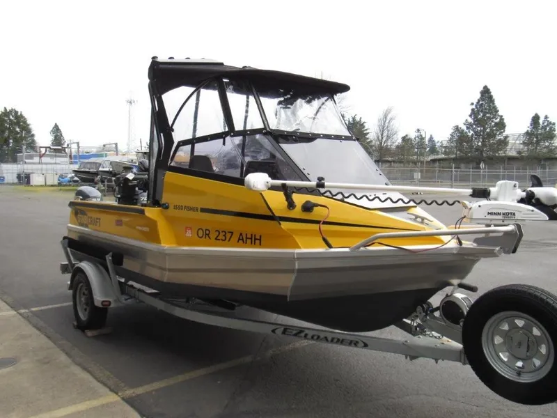 Slide: The Image of 2021 Stabicraft 1550 Fisher boat on trailer, yellow and black. - 7