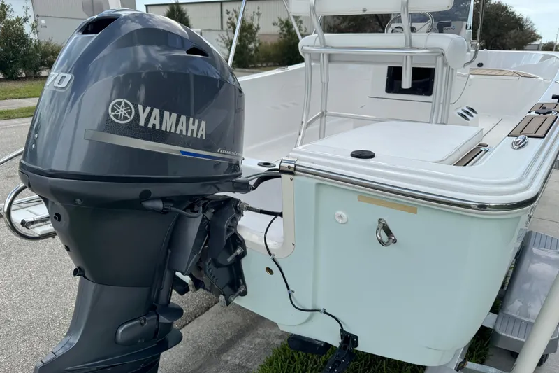 Slide: The Image of 2016 Sportsman Island Reef 17 Center Console boat side view with logo. - 13