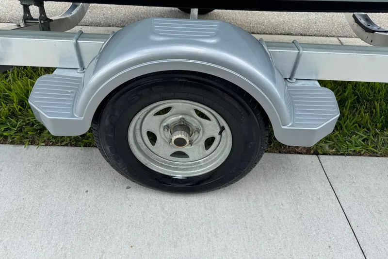 Slide: The Image of 2016 Sportsman Island Reef 17 Center Console boat with Yamaha 70 engine, featuring teak-style deck. - 18