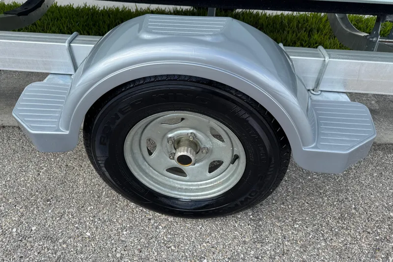 Slide: The Image of 2016 Sportsman Island Reef 17 Center Console boat deck with wood finish. - 19