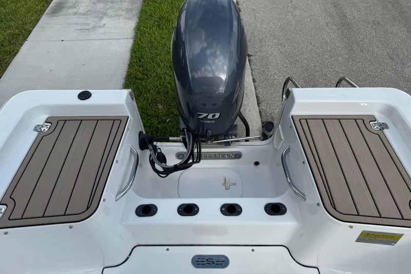 Slide: The Image of 2016 Sportsman Island Reef 17 Center Console boat deck with wood finish. - 20